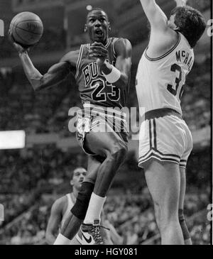 Chicago Bulls Michael Jordan scores on Boston Celtics Kevin McHale in game action at the Boston garden in Boston Mass photo by bill belknap Stock Photo