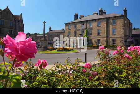 Public flower gardens near to the Rutland Hotel (R) in the centre of Bakewell; a pretty market town, Derbyshire Dales England UK Stock Photo