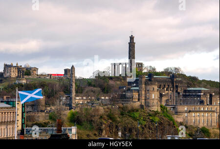 A view of Calton Hill, Edinburgh from the old town showing a saltire flag blowing in the wind. Stock Photo