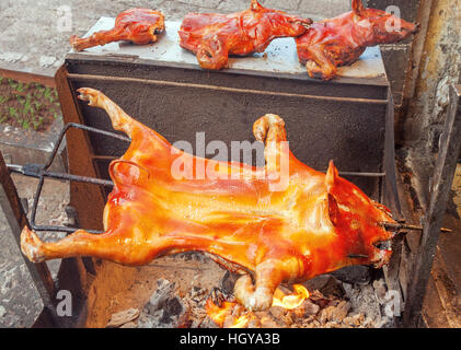Roasted pig on a spit, the Chinese traditional barbecue concept. Stock Photo