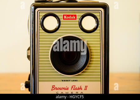 Classic Kodak Box Brownie camera on polished wood top Stock Photo