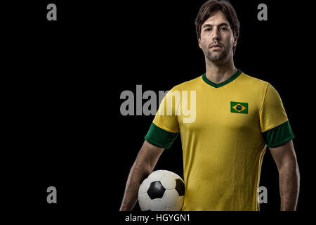 Brazilian soccer player, celebrating on a Black background. Stock Photo