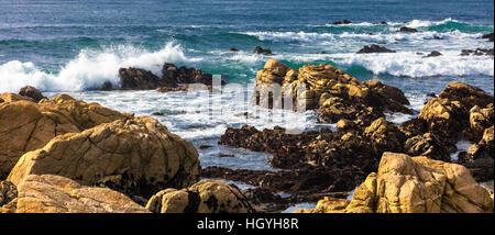 Beautiful scenery on the sea shore, the waves and huge rocks Stock Photo