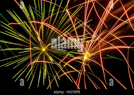 Green and red fireworks in night sky, Quebec, Canada Stock Photo