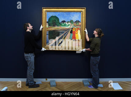Potsdam, Germany. 13th Jan, 2017. Workers at the newly opened Barberini Art Museum hang the Norwegian painter Edvard Munch's 'Girl on a Bridge' in Potsdam, Germany, 13 January 2017. Munch (1863-1944) finished the painting in 1902. It will take pride of place in the upcoming 'Modern Classics' exhibition which opens on the 23.01.17 in the Barberini Palace. Photo: Ralf Hirschberger/dpa-Zentralbild/dpa/Alamy Live News Stock Photo