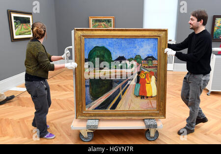 Potsdam, Germany. 13th Jan, 2017. Workers at the newly opened Barberini Art Museum hang the Norwegian painter Edvard Munch's 'Girl on a Bridge' in Potsdam, Germany, 13 January 2017. Munch (1863-1944) finished the painting in 1902. It will take pride of place in the upcoming 'Modern Classics' exhibition which opens on the 23.01.17 in the Barberini Palace. Photo: Ralf Hirschberger/dpa-Zentralbild/dpa/Alamy Live News Stock Photo