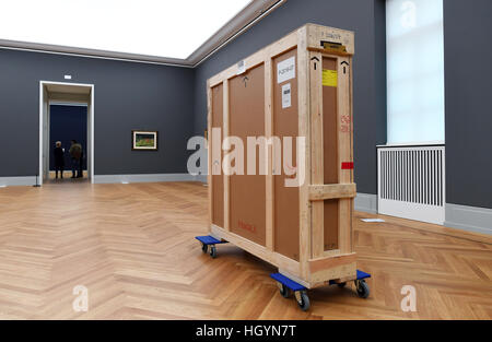 Potsdam, Germany. 13th Jan, 2017. The Norwegian painter Edvard Munch's 'Girl on a Bridge' arrives in a box at the newly opened Barberini Art Museum in Potsdam, Germany, 13 January 2017. Munch (1863-1944) finished the painting in 1902. It will take pride of place in the upcoming 'Modern Classics' exhibition which opens on the 23.01.17 in the Barberini Palace. Photo: Ralf Hirschberger/dpa-Zentralbild/dpa/Alamy Live News Stock Photo