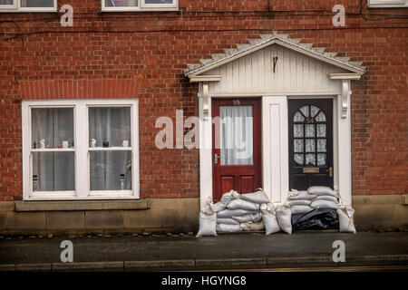 UK Weather. Whitby, North Yorkshire, UK. 13th January 2017. Sandbags placed infront of doors as a precaution against flooding in Whitby. Copyright Ian Wray/Alamy Live News Stock Photo