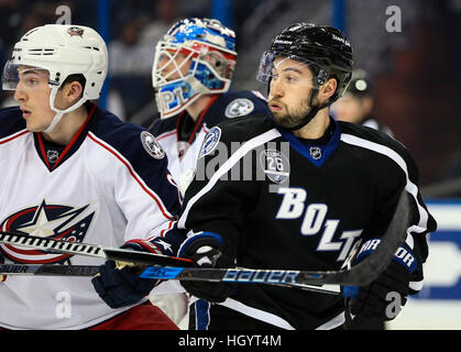 Tampa, USA. 13th Jan, 2017. Tampa Bay Lightning center Tyler Johnson (9) battles in front of the net against Columbus Blue Jackets defenseman Zach Werenski (8) during first period action at the Amalie Arena in Tampa. © Dirk Shadd/Tampa Bay Times/ZUMA Wire/Alamy Live News Stock Photo