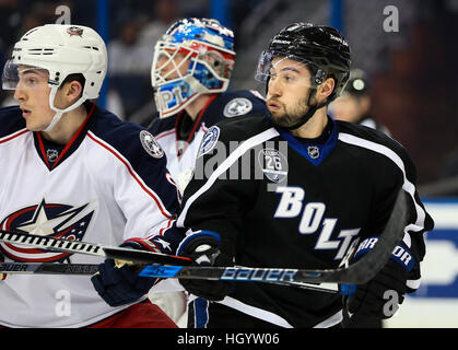 Tampa, USA. 13th Jan, 2017. Tampa Bay Lightning center Tyler Johnson (9) battles in front of the net against Columbus Blue Jackets defenseman Zach Werenski (8) during first period action at the Amalie Arena in Tampa.© Dirk Shadd/Tampa Bay Times/ZUMA Wire/Alamy Live News Stock Photo