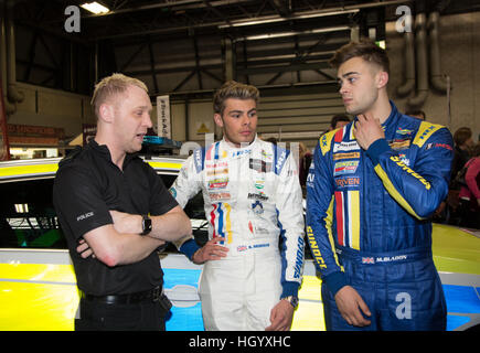 Birmingham, UK 14th Jan, 2017 Seb Morris and Max Bladon talking to a police officer on the West Midlands Police stand at the Autosport show. © steven roe/Alamy Live News Stock Photo