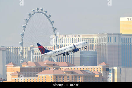Las Vegas, Nevada, USA. 12th Jan, 2015. A Delta Air Lines jet passes by the Las Vegas Strip after taking off from McCarran International Airport in Las Vegas. Credit: David Becker/ZUMA Wire/Alamy Live News Stock Photo