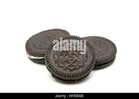 Chocolate cookies with vanilla cream filling on white background Stock Photo