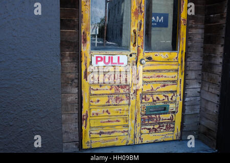 A door with a 'pull' sign on it. Stock Photo