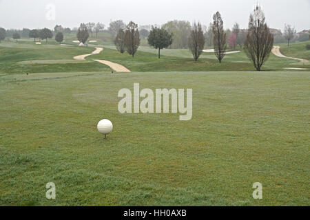 golf course in the morning with autumn mist . Stock Photo