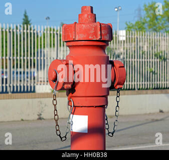 Red fire hydrant water pipe near the road.   for emergency  access Stock Photo