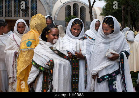 Wedding in St Mary of Zion church, Aksum, Ethiopia. Wedding guests, perfectly dressed for the occasion, at the modern St Mary of Zion Church of Axum. Stock Photo