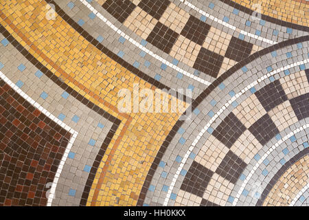 Mosaic tile abstract background in shades of brown, yellow, beige, white and blue. Stock Photo