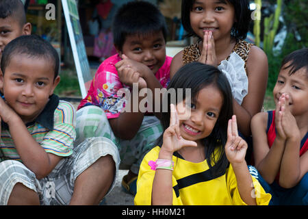 Children having fun in Koh Lanta. Krabi. Thailand. Asia. Ko Lanta is technically called Ko Lanta Yai, the largest of 52 islands in an archipelago prot Stock Photo