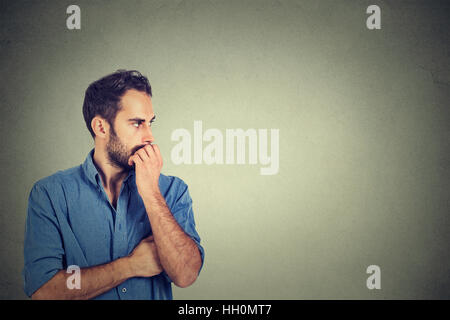 Preoccupied anxious young man Stock Photo