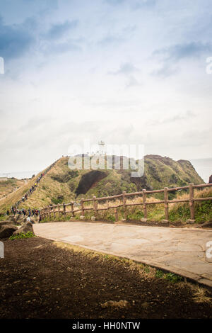 Jeju Island, Korea - November 13, 2016 : The tourist visited Lighthouse, the target of treking in Seopjikoji. Located at the end of the Eastern shore  Stock Photo