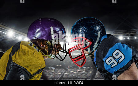 Two american football players fighting for ball. Mixed media Stock Photo