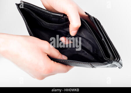 Holding in hands empty black wallet on white background Stock Photo