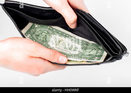 Holding in hands open wallet with money in it Stock Photo