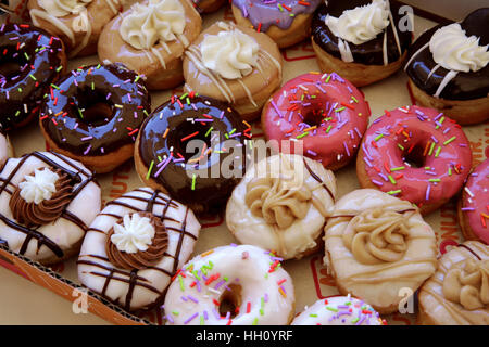 Sugar coated colorful doughnuts Stock Photo