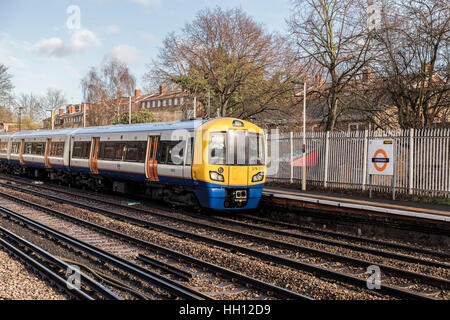 Overground train pulls into the platform at Sydenham station in south London se26 Stock Photo