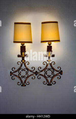 Old wall lamp made of metal with shade from canvas Stock Photo