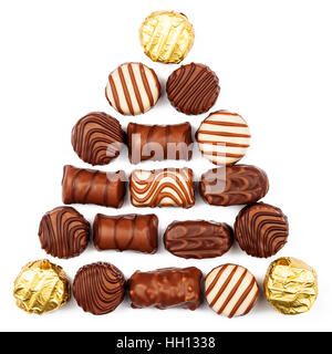 Triangle made of chocolate candies isolated on white background Stock Photo