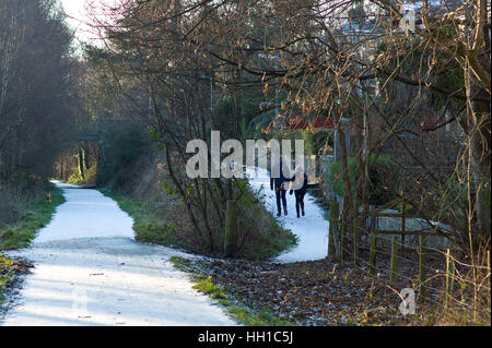 Walkers  on the Deeside way at Cults, Aberdeen. Former Royal Deeside Railway line running from Aberdeen to Ballater in Scotland Stock Photo