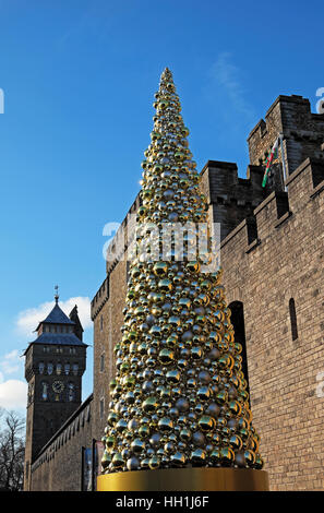 Gold golden baubles on civic Christmas Tree outside Cardiff Castle in city centre Wales UK  KATHY DEWITT Stock Photo