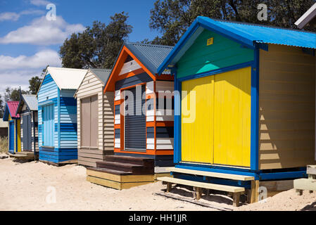 The rainbow coloured bathing boxes are a symbol of summer and a tourist attraction of the Mornington Peninsula, south of Melbourne, Australia Stock Photo