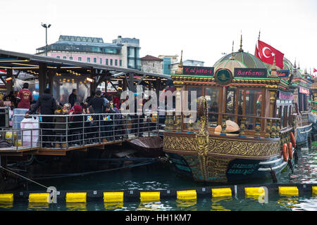 Boats selling Balik Ekmek ('fish in bread') at Eminonu dock in Istanbul, Turkey. Stock Photo