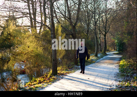 Walker on the Deeside way at Cults, Aberdeen. Former Royal Deeside Railway line running from Aberdeen to Ballater in Scotland Stock Photo