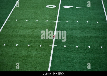 American football field, of Columbia University in New York City, with a ball standing on the 40 yard line, ready to be kicked Stock Photo