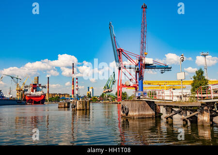 View wharf shipyard with high chimneys in the background in Gdansk, Poland. Stock Photo