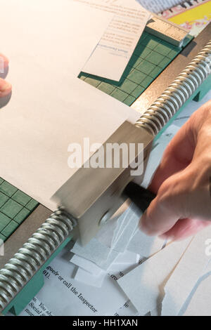 Worker Cutting Paper with a Rotat=ry Paper Trimmer Stock Photo