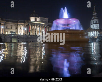 Fountain at night in Trafalgar Square with The National Gallery