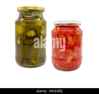 Pickled cucumbers and peppers in tomato sauce in jar Stock Photo