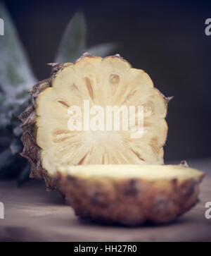 Sliced pineapple on wooden surface Stock Photo