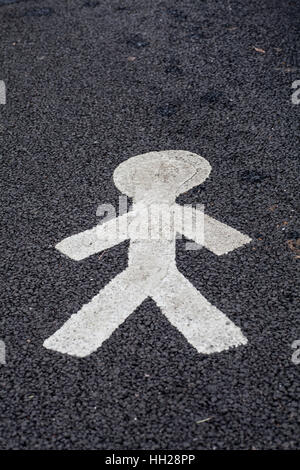 Painted white image of a man shows the safe footpath for pedestrians Stock Photo
