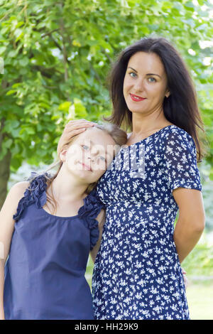 Portrait beautiful mother and daughter in summer Stock Photo