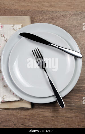 Dining etiquette - I still eat, Resting position. Fork and knife signals with location of cutlery set Stock Photo