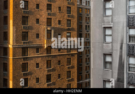 Brick-built skyscraper in early morning light with long shadows, New York Stock Photo