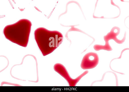 Heart shape from red wine on white background, Happy Valentine's Day Stock Photo