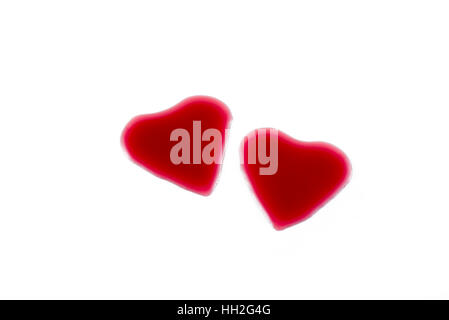 Heart shape from red wine on white background, Happy Valentine's Day Stock Photo