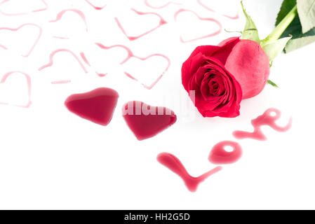 Heart shape from red wine and Rose flower on white background, Happy Valentine's Day Stock Photo